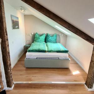 a bedroom with a bed in the attic at Ferienhaus Finca de vida y luz in Auderath