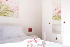 Postel nebo postele na pokoji v ubytování GuestReady - Machico sea view residence - B