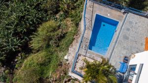 Bazén v ubytování GuestReady - A marvellous stay in Calheta nebo v jeho okolí + 37 fotografií