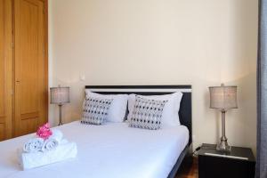 Giường trong phòng chung tại GuestReady - Oasis Getaway in Madeira