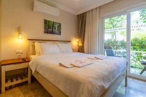 Postel nebo postele na pokoji v ubytování HOTEL DALYANCE