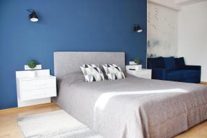 Кровать или кровати в номере Amsterdam Lviv Apartments