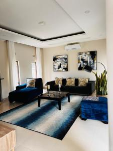 a living room with a couch and a table at Kaya Apartments 2 in Lusaka