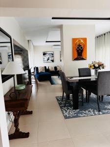 a living room with a table and a couch at Kaya Apartments 2 in Lusaka