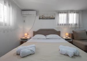 Postel nebo postele na pokoji v ubytování Apartments Mary + 37 fotografií