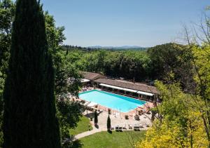an overhead view of a swimming pool in a garden at Borgo San Luigi in Monteriggioni