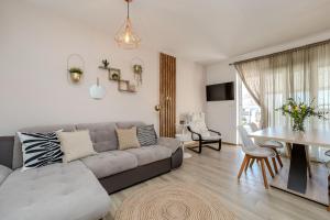 a living room with a couch and a table at Luxury Home Polo in Bibinje