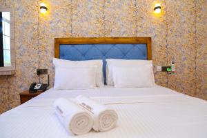 CROWN REGENCY- BADULLA客房内的一张或多张床位