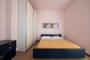 Postel nebo postele na pokoji v ubytování Residence Palazzo Gasparroni