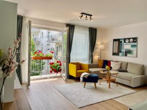 a living room with a couch and a table at Feel Home DeLuxe CORVIN # FREE PARKING # AC # Elevator in Budapest