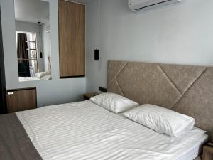 Postel nebo postele na pokoji v ubytování Optima Collection Kamianske