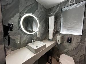Koupelna v ubytování Optima Collection Kamianske