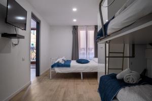 a bedroom with two bunk beds and a balcony at Casa Canarino in Riva del Garda