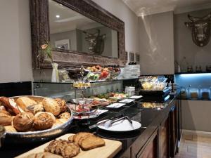 a buffet with a lot of different types of food at Villahotel Rheinblick in Cologne
