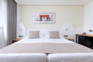 A bed or beds in a room at Alexandre FrontAir Congress
