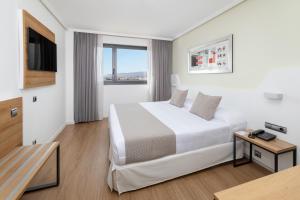 A bed or beds in a room at Alexandre FrontAir Congress