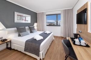 A bed or beds in a room at Alexandre FrontAir Congress
