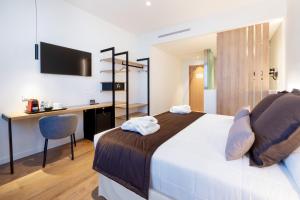 A bed or beds in a room at Alexandre FrontAir Congress