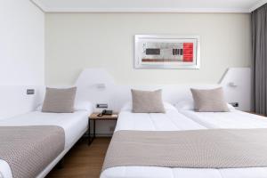 A bed or beds in a room at Alexandre FrontAir Congress