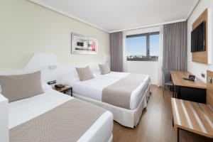 A bed or beds in a room at Alexandre FrontAir Congress