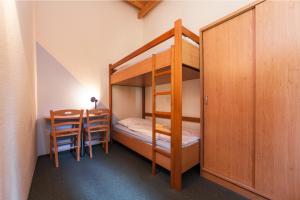 Postel nebo postele na pokoji v ubytování Trixi Park Zittauer Gebirge - Ferienhäuser, Hotel und Camping + 37 fotografií