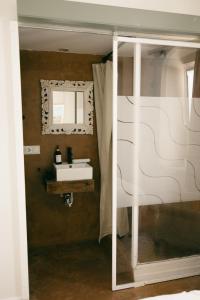 a bathroom with a sink and a mirror at Casa Africa in Tarifa