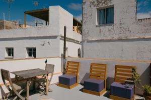 a table and chairs sitting on a balcony at Casa Africa in Tarifa