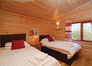 Krevet ili kreveti u jedinici u objektu Nunland Hillside Lodges