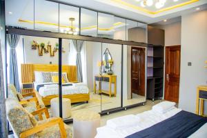 a bedroom with a large glass wall at Casablanca in Kigali in Kigali