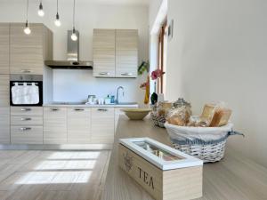 a kitchen with a box on the floor at Come a Casa Tua in Sassari