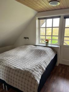 Kallerup Hgård客房内的一张或多张床位