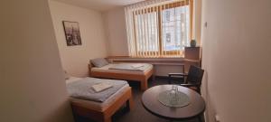 Postel nebo postele na pokoji v ubytování Hotel Rada