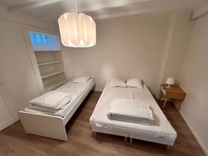 Posteľ alebo postele v izbe v ubytovaní Appartement RDC 9 personnes, 2 chambres, wifi, proche du centre