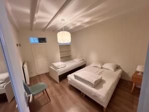 Posteľ alebo postele v izbe v ubytovaní Appartement RDC 9 personnes, 2 chambres, wifi, proche du centre