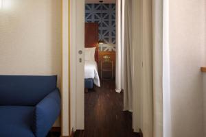 Postel nebo postele na pokoji v ubytování Maison Roma Piazza di Spagna UNA Esperienze