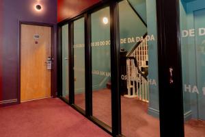 a hallway with glass doors and a stairway at Skeffington Arms Hotel in Galway
