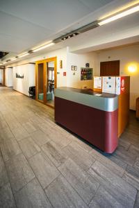 a lobby with a reception desk in a building at Baden Youth Hostel in Baden