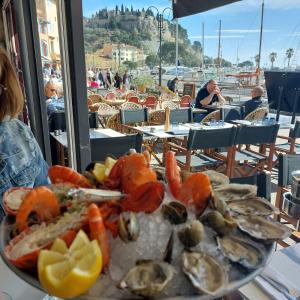 a plate of food with seafood on a table at Appartement le Mehari in Cassis