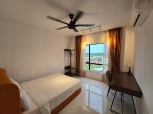 a bedroom with a bed and a ceiling fan at Manhattan Condomium Water Park Land @ Ipoh in Ipoh