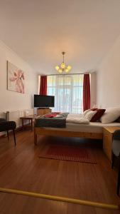a bedroom with a large bed and a window at Apartman Danka in Bük