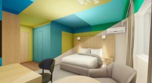 a bedroom with a bed and a couch and a chair at Skeffington Arms Hotel in Galway