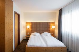 Letto o letti in una camera di Hotel Olympic - Montana Center