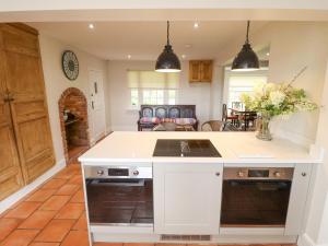 a kitchen with a white island in a room at Moon Field Lodge in Scunthorpe