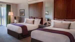 a hotel room with two beds in a room at Old Course Hotel St Andrews in St. Andrews