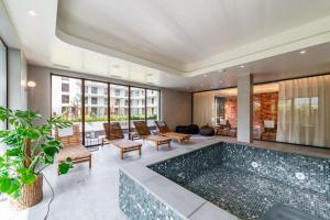 a pool in the middle of a house at Apartamenty Podhale in Zakopane