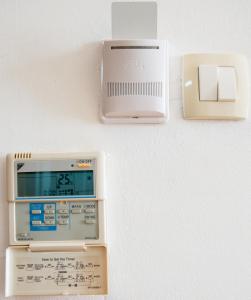 an alarm clock and a scale on a wall at Apartments Ivona in Budva