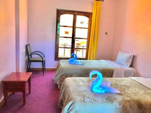 Postel nebo postele na pokoji v ubytování SEVEN DAYS HOTEL