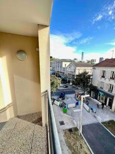 a balcony of a building with a view of a street at Elegant apartment Paris Bagnolet 303 in Bagnolet