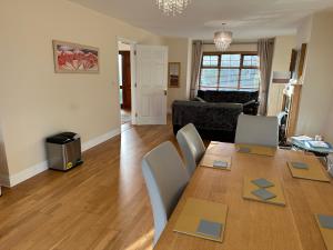 a living room with a dining table and a living room at Home near the River Shannon in Rooskey