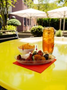 a plate of food on a table with a drink at Zurich Youth Hostel in Zurich